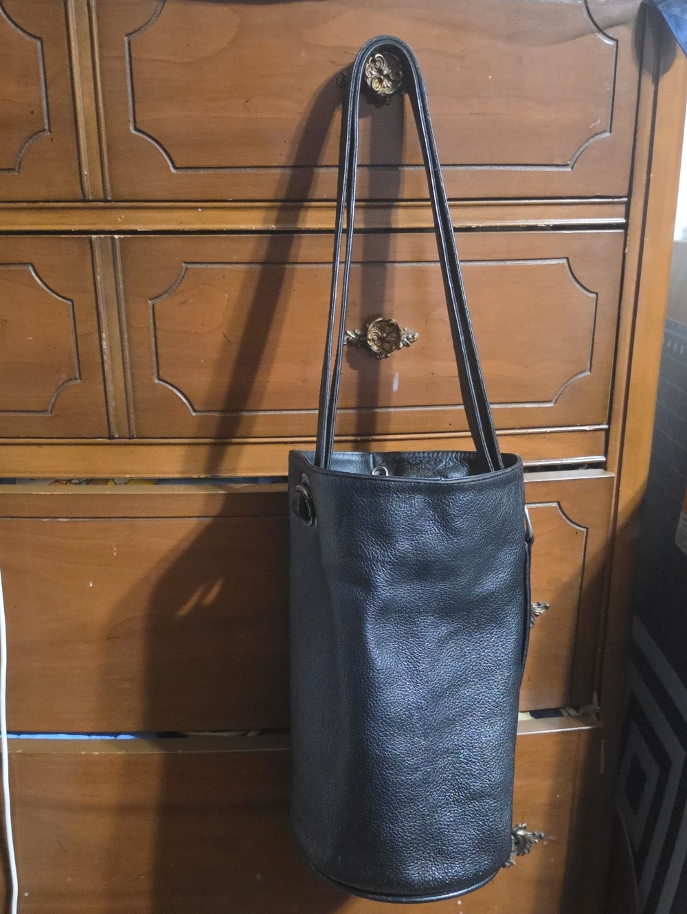 Classic Black Leather Shoulder Bucket Bag with Grommet Detail